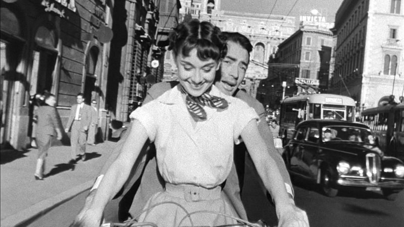 1200px Audrey Hepburn and Gregory Peck on Vespa in Roman Holiday trailer